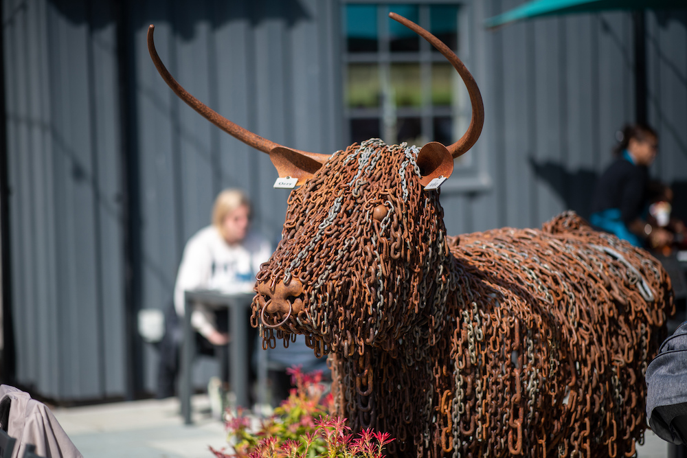 Highland cow sculpture made of metal chains