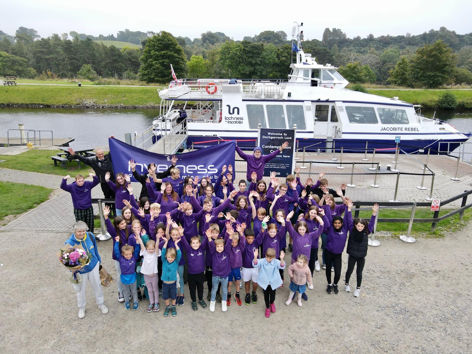 Unveiling the banner at Jacobite Loch Ness Cruises